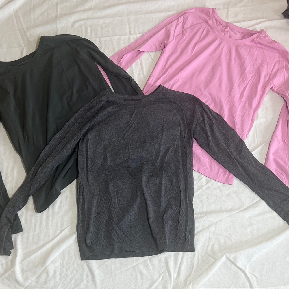 Set of three women’s Athleta momentum long sleeves